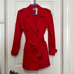 Red Diane Gilman trench coat.